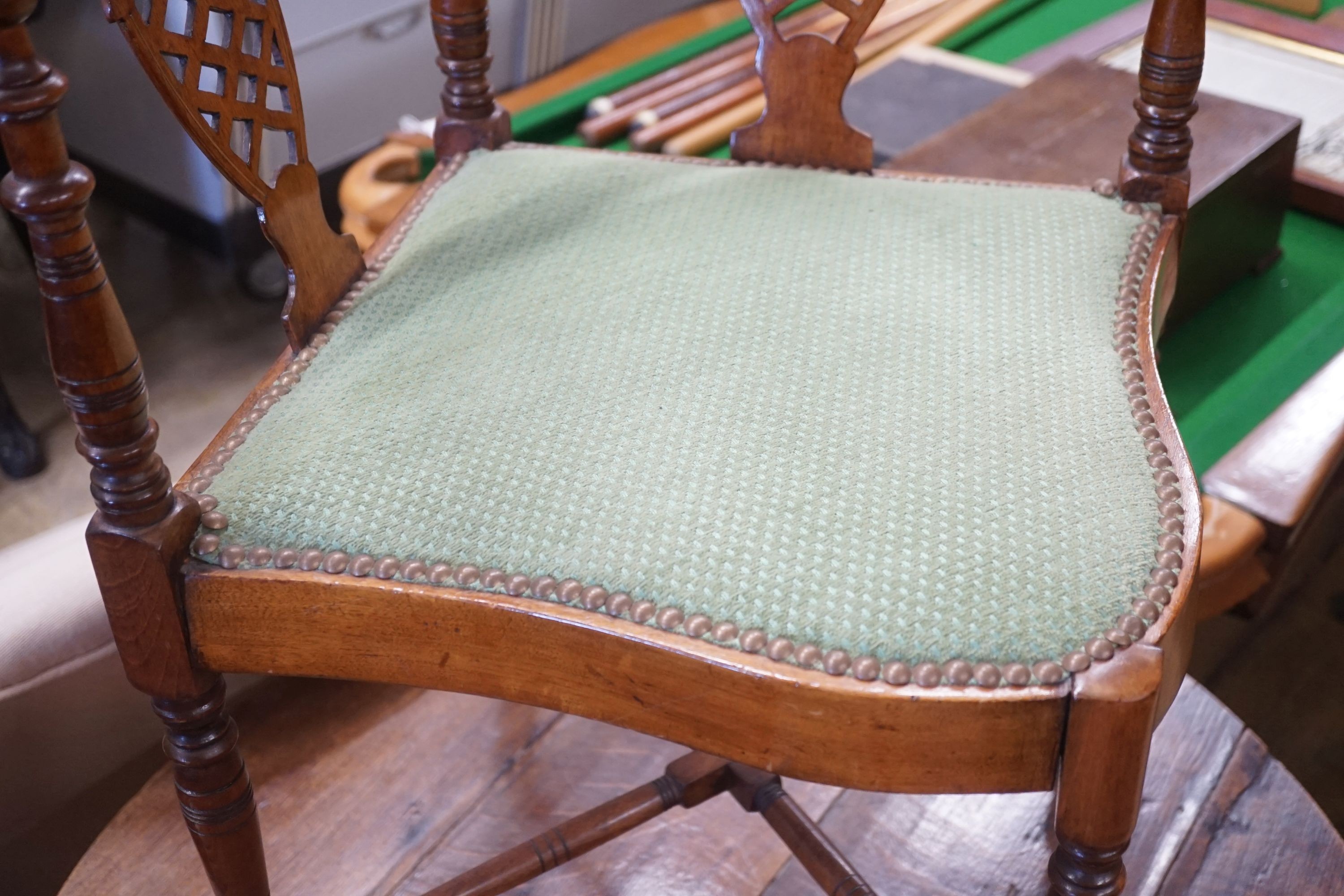 A late Victorian walnut corner elbow chair